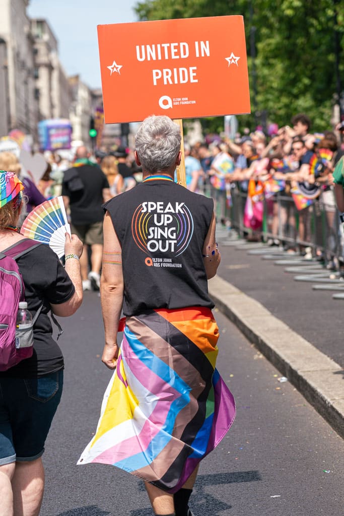 Elton John AIDS Foundation at the London Pride Parade 2024 with a sign that says united in pride
