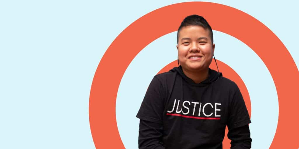 Dr. Bec Sokha Keo from the University of Houston, wearing a black top with the word 'Justice' on it.