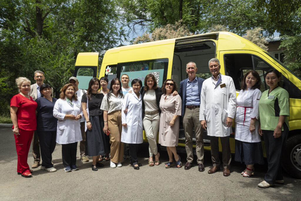 Daniel O’Day, Chairman and CEO of Gilead Sciences and Anne Aslett, CEO of the Elton John AIDS Foundation, meeting with staff at the Almaty City AIDS Centre who are responsible for running outreach services for key populations living with or at risk of HIV.
